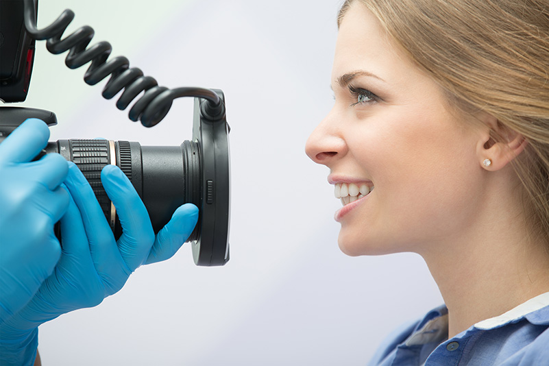 Dentist with camera and patient