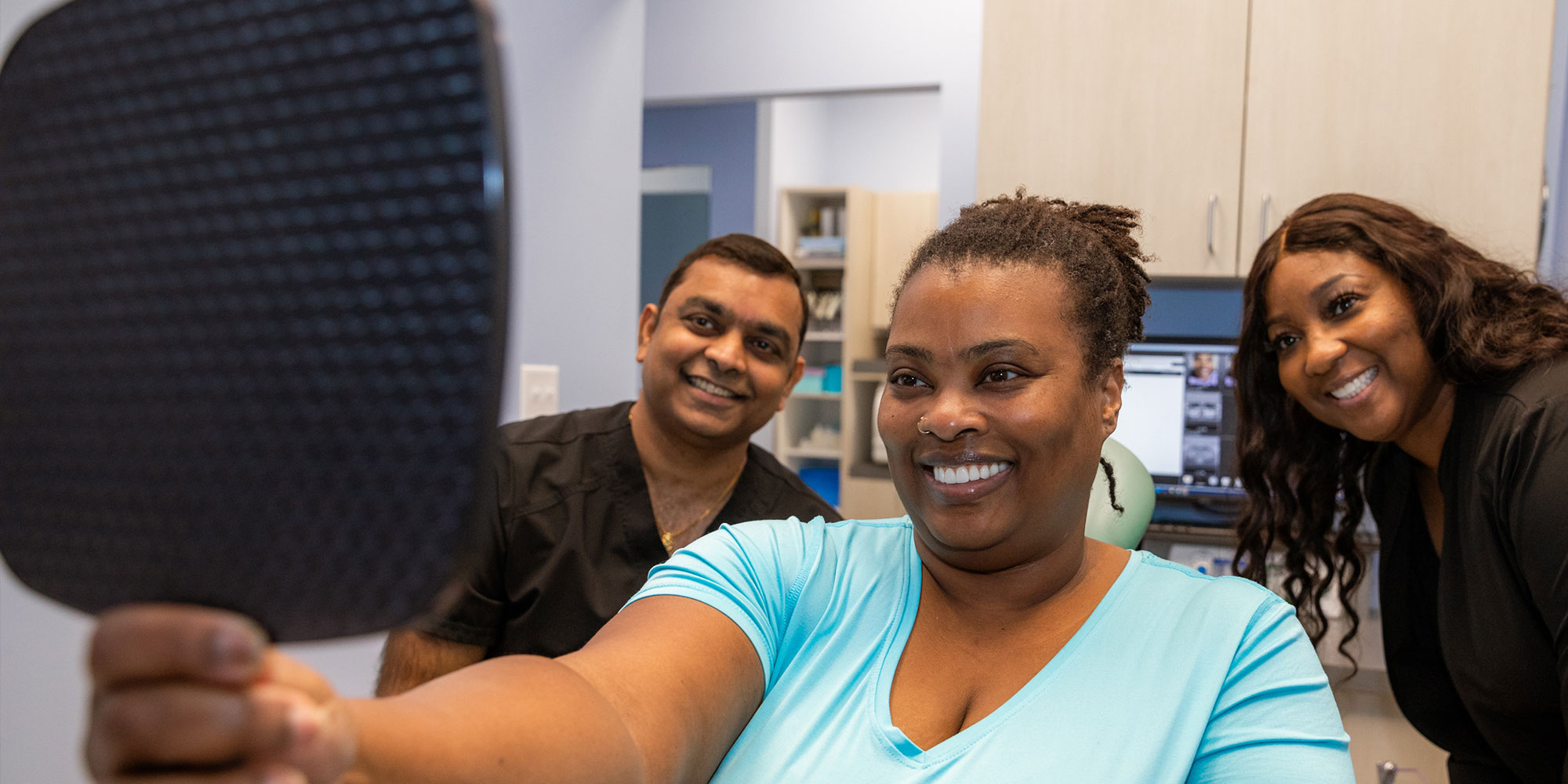 patient smiling confidently after their dental procedure