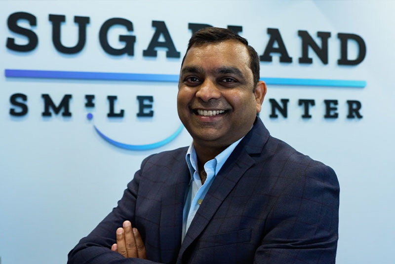 headshot of doctor inside of the dental practice within the lobby