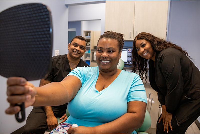 patient smiling confidently after their dental procedure