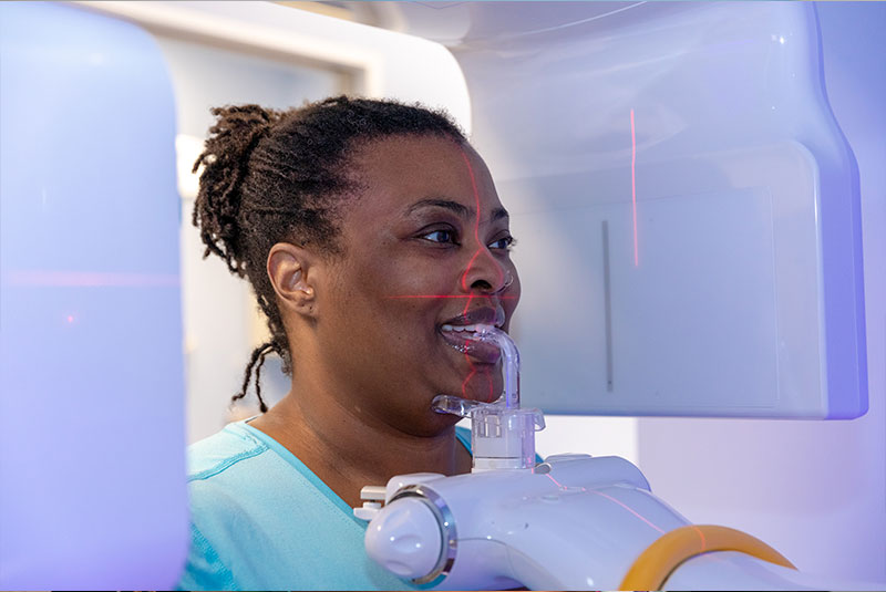 patient undergoing x-ray scan for dental procedure